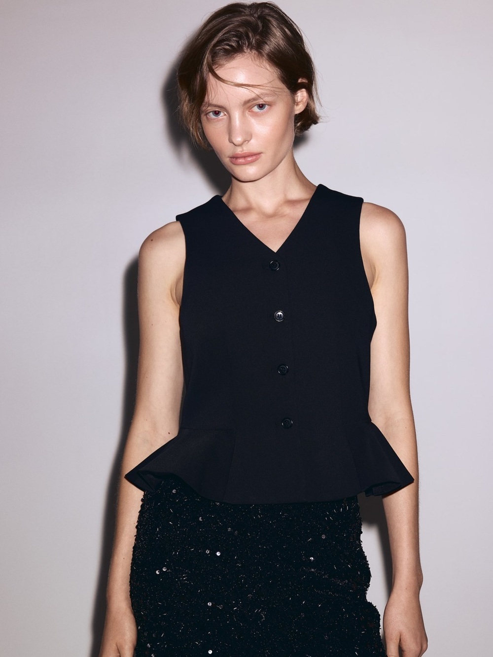 V-NECK VEST WITH PEPLUM